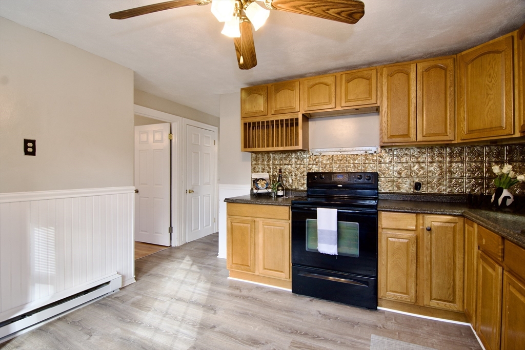 25 Chudy Street Three Rivers, MA 01080 - Photo 19 of 42 a kitchen with stainless steel appliances granite countertop a stove a sink and a refrigerator