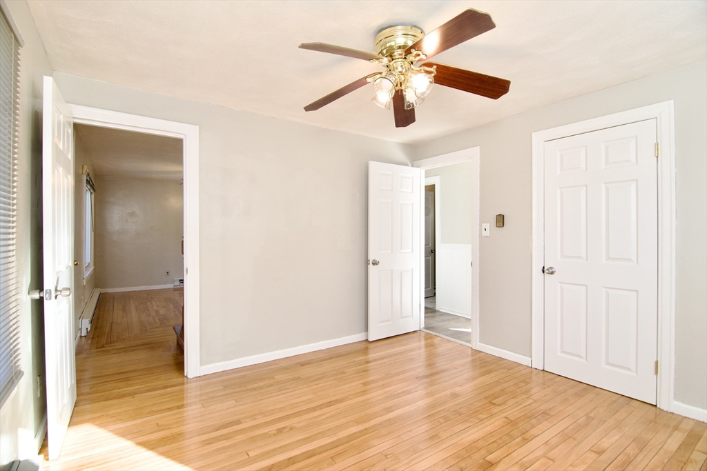 25 Chudy Street Three Rivers, MA 01080 - Photo 22 of 42 an empty room with wooden floor fan and windows