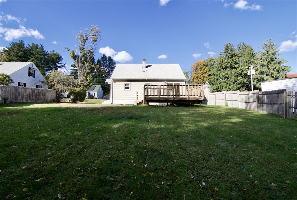 25 Chudy Street Three Rivers, MA 01080 - Photo 3 of 42 a view of a house with a big yard and potted plants