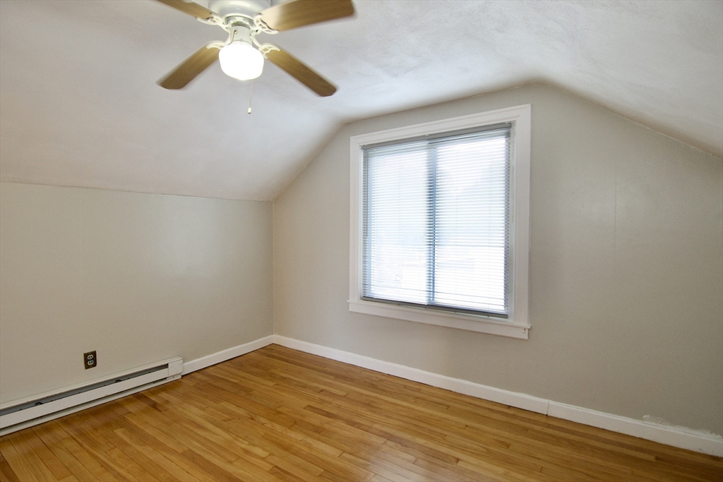 25 Chudy Street Three Rivers, MA 01080 - Photo 37 of 42 an empty room with wooden floor fan and windows