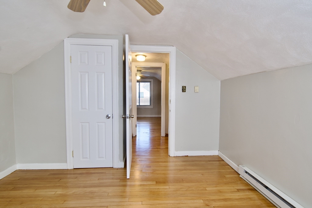25 Chudy Street Three Rivers, MA 01080 - Photo 38 of 42 a view of empty room with wooden floor and fan