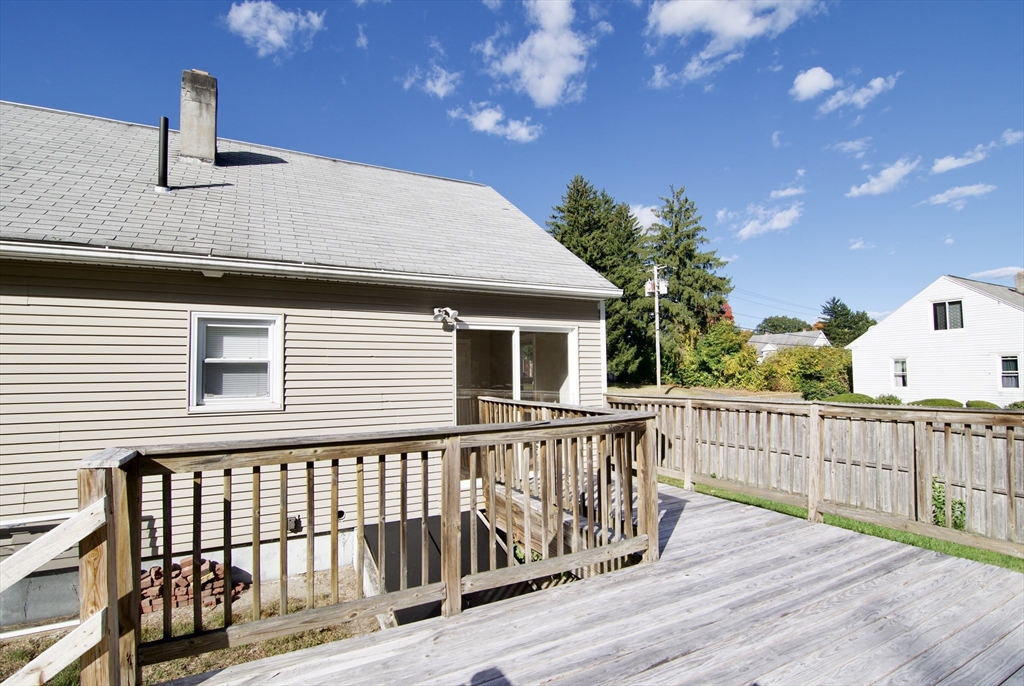 25 Chudy Street Three Rivers, MA 01080 - Photo 4 of 42 a balcony view with wooden floor and fence