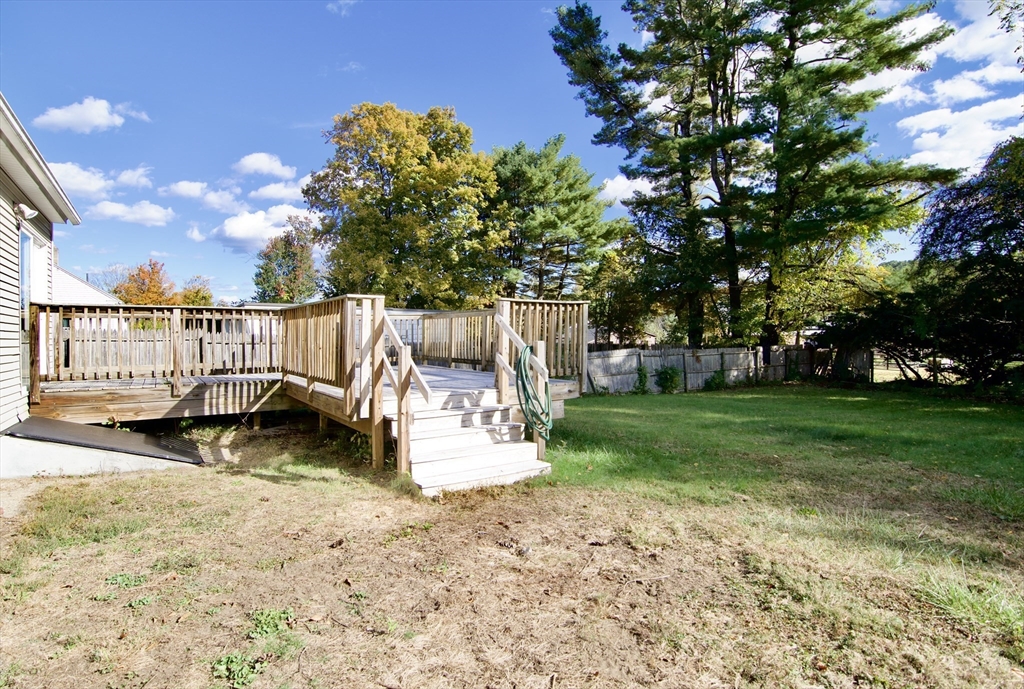 25 Chudy Street Three Rivers, MA 01080 - Photo 6 of 42 a view of a deck with a bench and garden