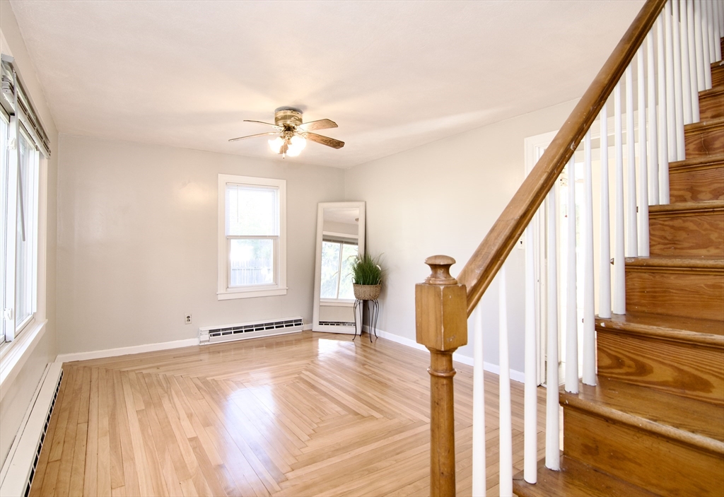 25 Chudy Street Three Rivers, MA 01080 - Photo 8 of 42 a view of an empty room with wooden floor and fan