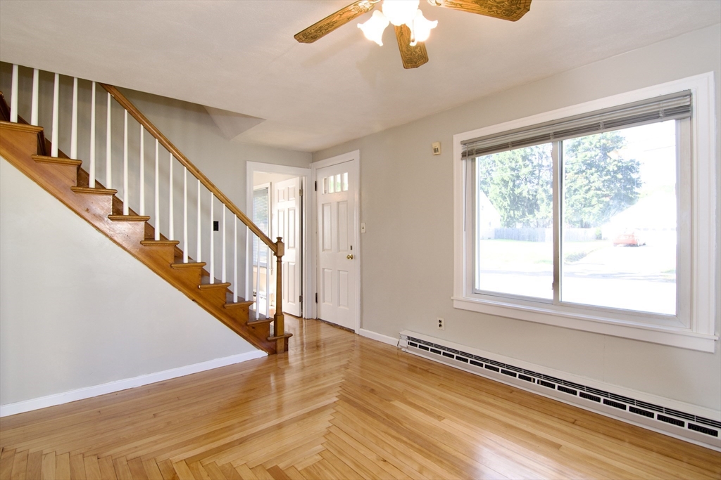 25 Chudy Street Three Rivers, MA 01080 - Photo 9 of 42 a view of an entryway with wooden floor and a chandelier fan