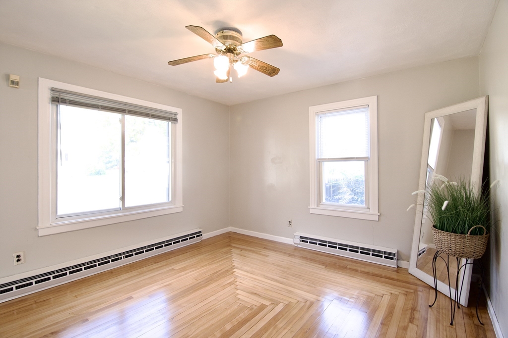 25 Chudy Street Three Rivers, MA 01080 - Photo 10 of 42 a view of an empty room with a window and wooden floor