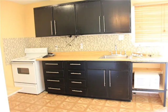 a bathroom with a sink vanity and a mirror
