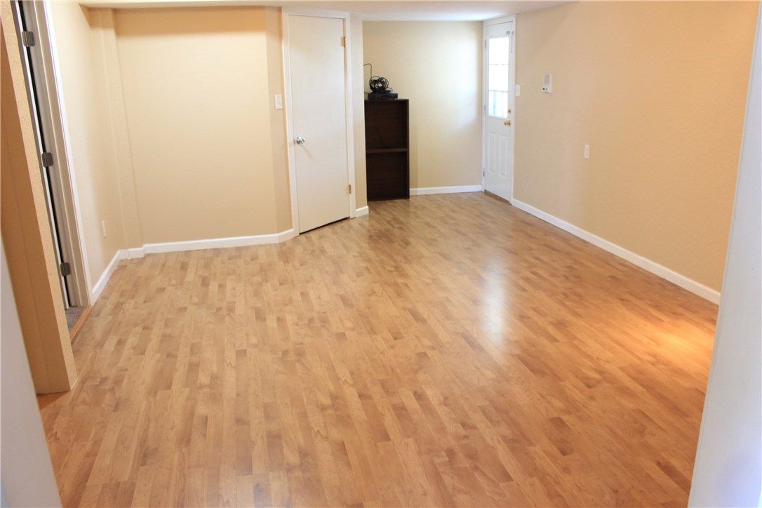 6 Fairview Drive Round Rock, TX 78665 - Photo 4 of 12 a view of an empty room with wooden floor