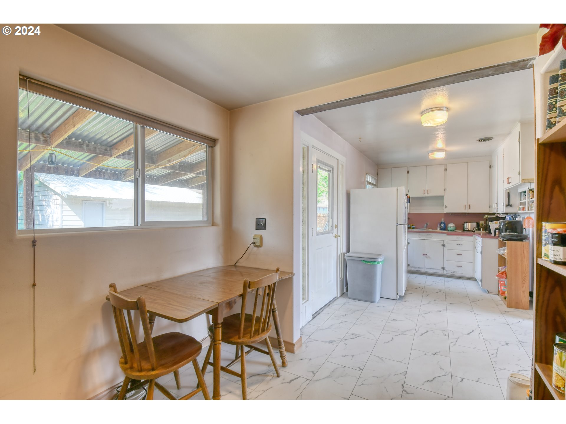 611 Southwest Birch Street Pilot Rock, OR 97868 - Photo 12 of 26 a open kitchen with a table and chairs