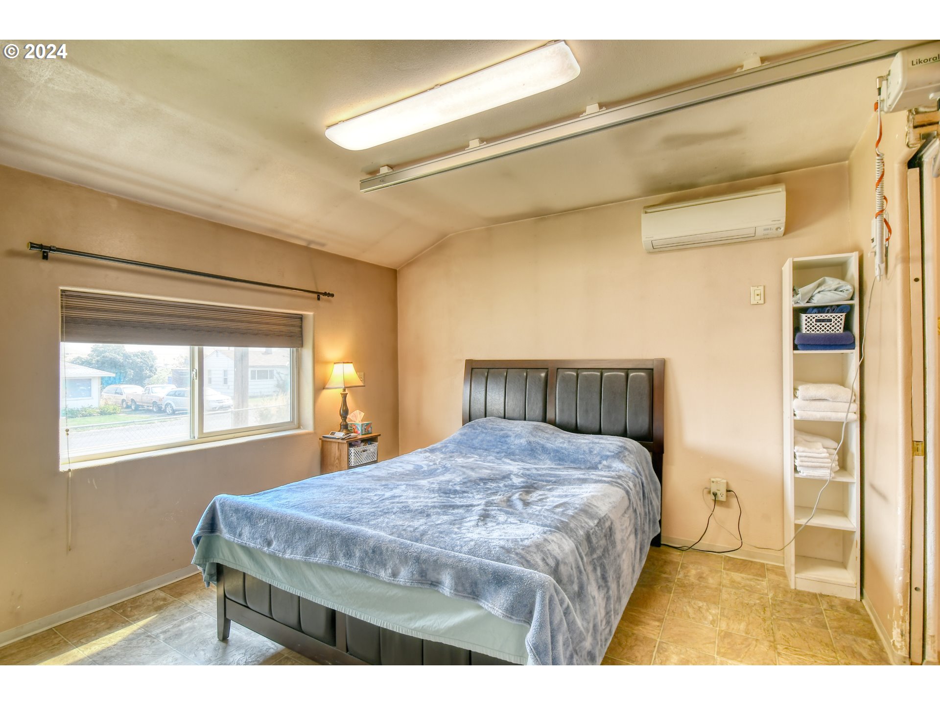 611 Southwest Birch Street Pilot Rock, OR 97868 - Photo 13 of 26 a bedroom with a bed next to a window