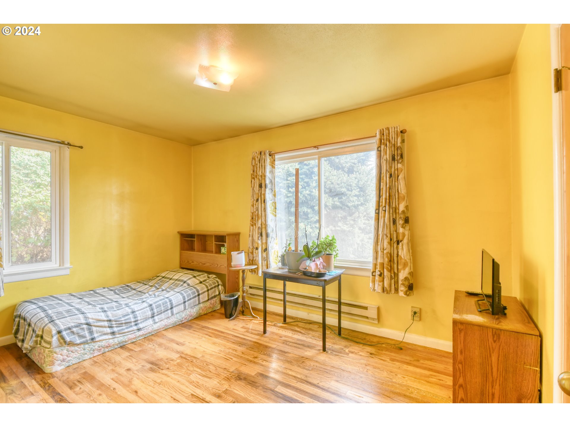 611 Southwest Birch Street Pilot Rock, OR 97868 - Photo 17 of 26 a bedroom with a bed and painted walls