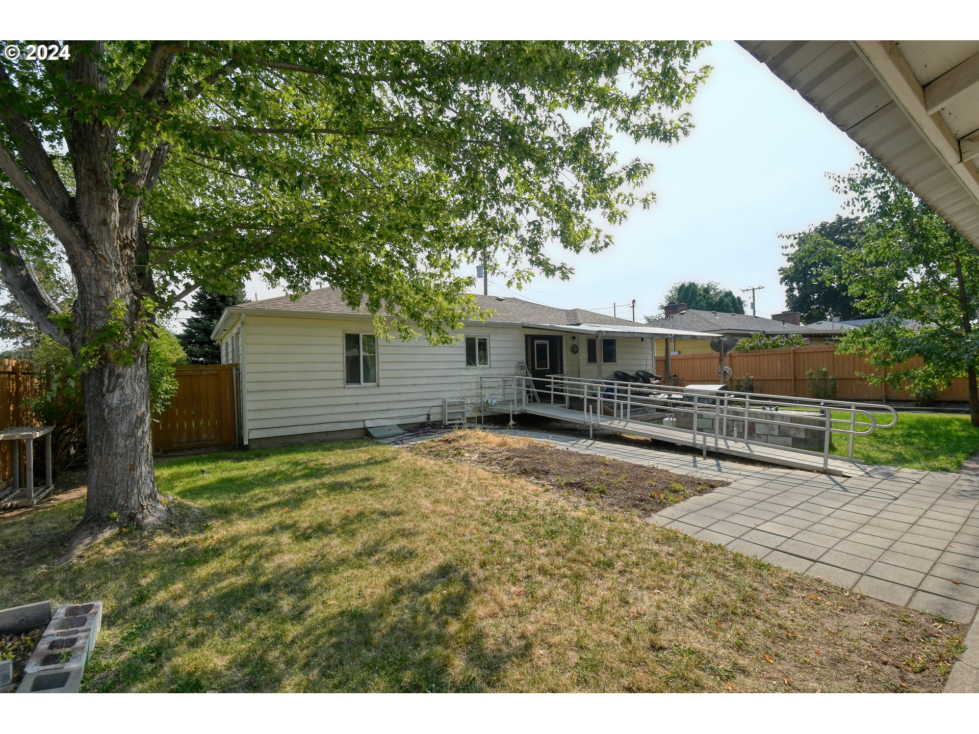 611 Southwest Birch Street Pilot Rock, OR 97868 - Photo 21 of 26 a swimming pool with outdoor seating and yard