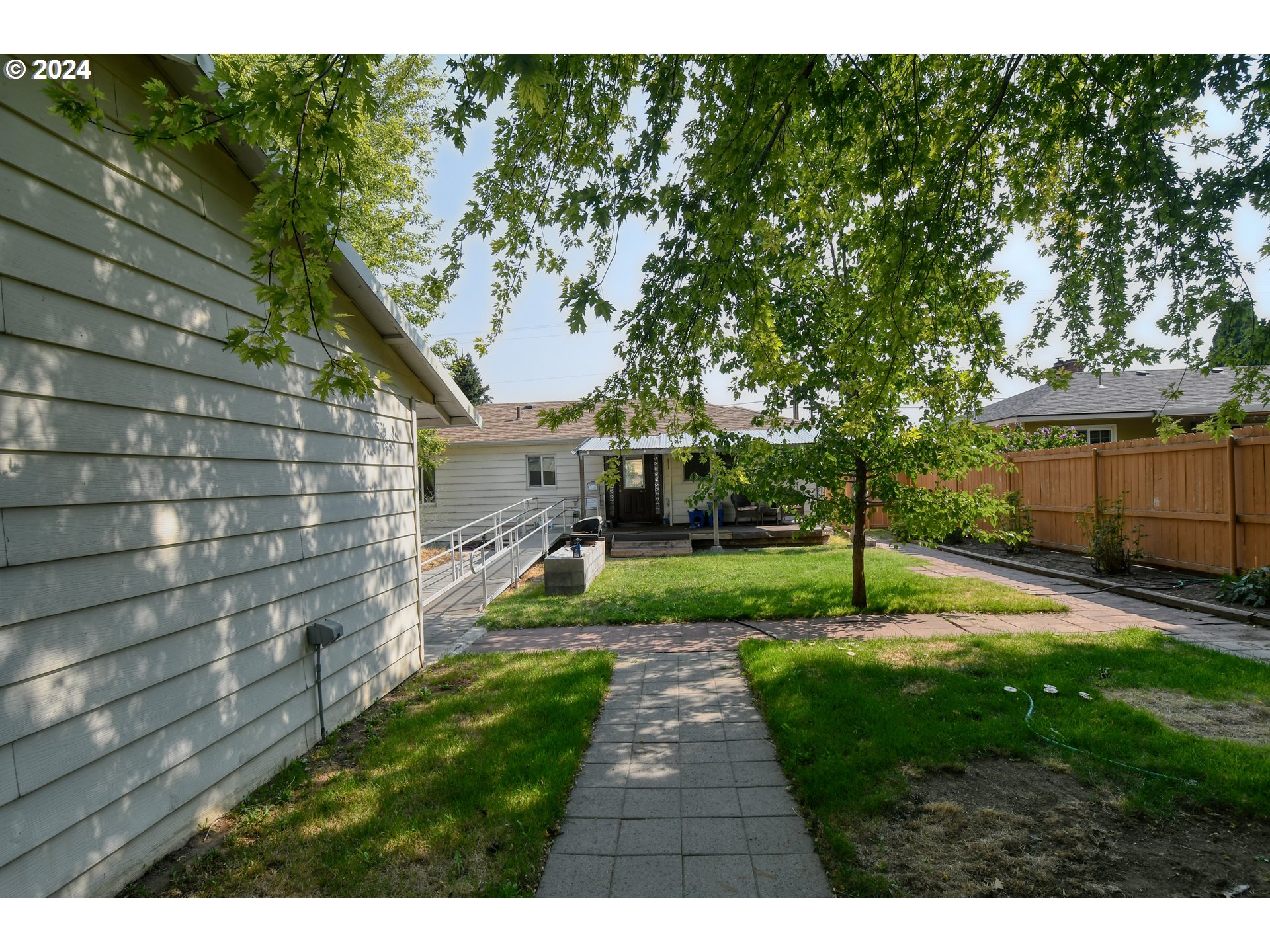 611 Southwest Birch Street Pilot Rock, OR 97868 - Photo 22 of 26 a view of a backyard with a garden