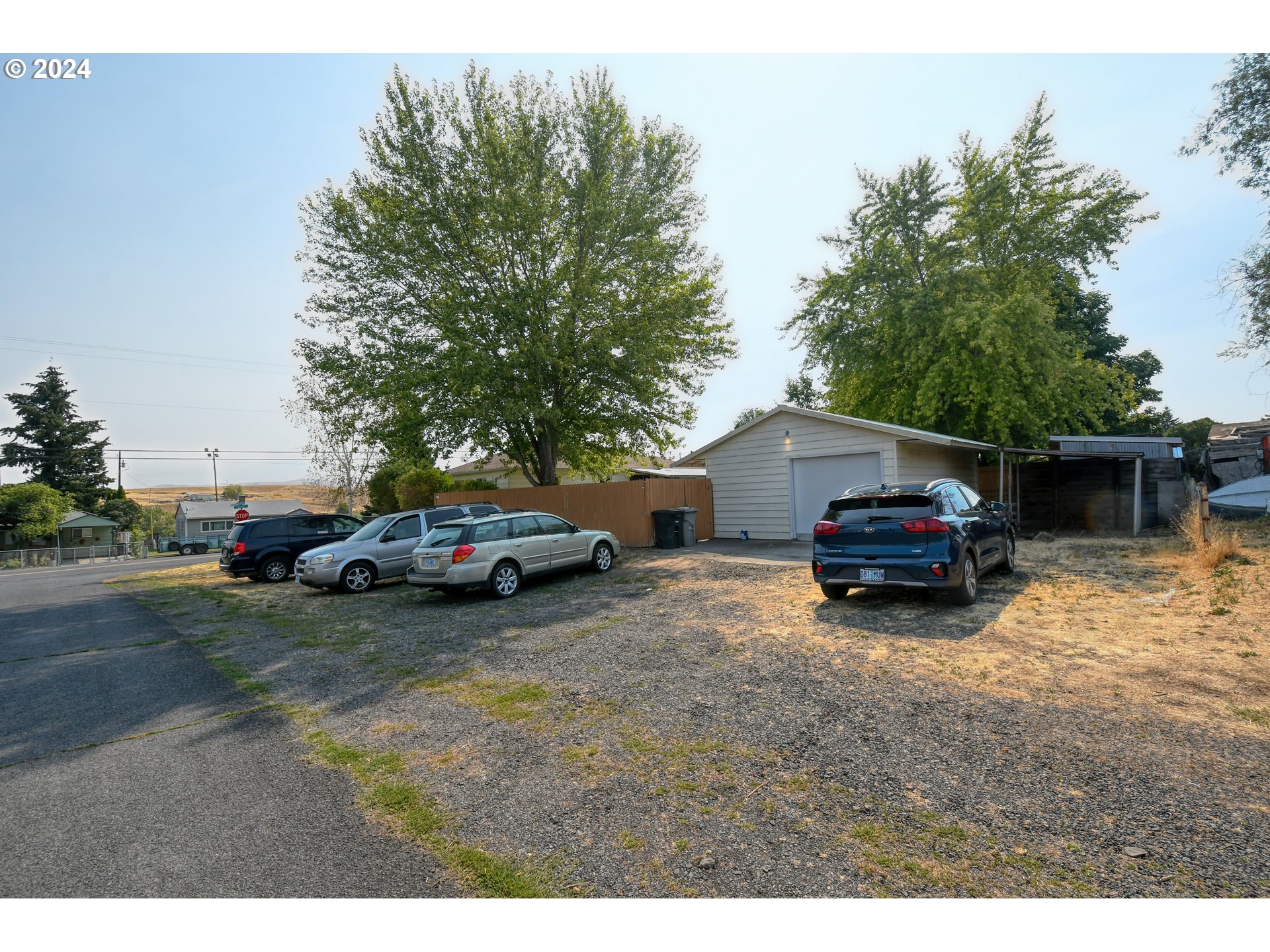 611 Southwest Birch Street Pilot Rock, OR 97868 - Photo 25 of 26 a view of a house with truck parked on a road