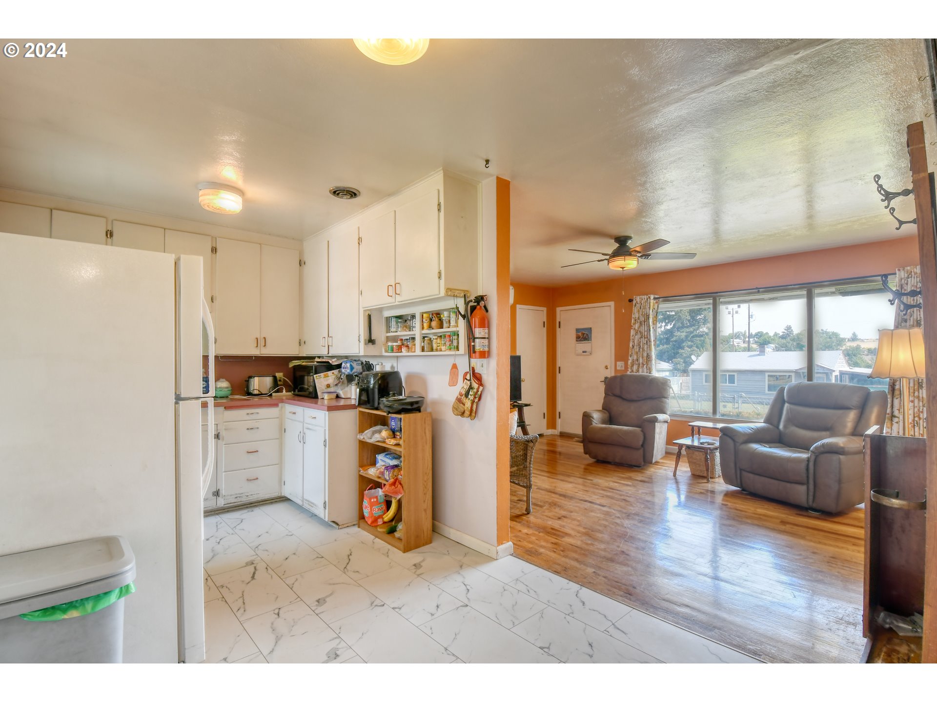 611 Southwest Birch Street Pilot Rock, OR 97868 - Photo 7 of 26 a kitchen view with appliances a counter space and living room view