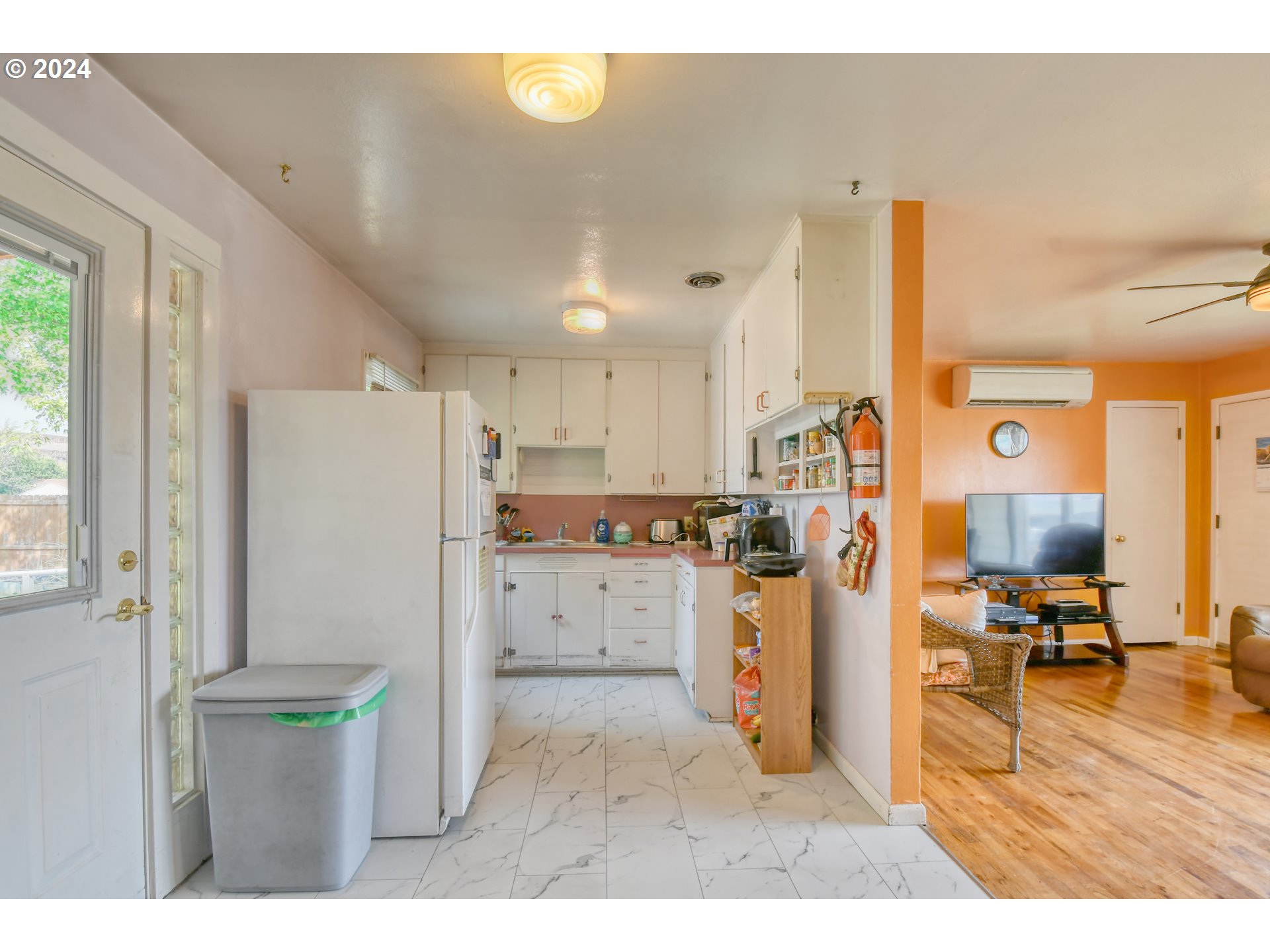 611 Southwest Birch Street Pilot Rock, OR 97868 - Photo 10 of 26 a kitchen with refrigerator and cabinets