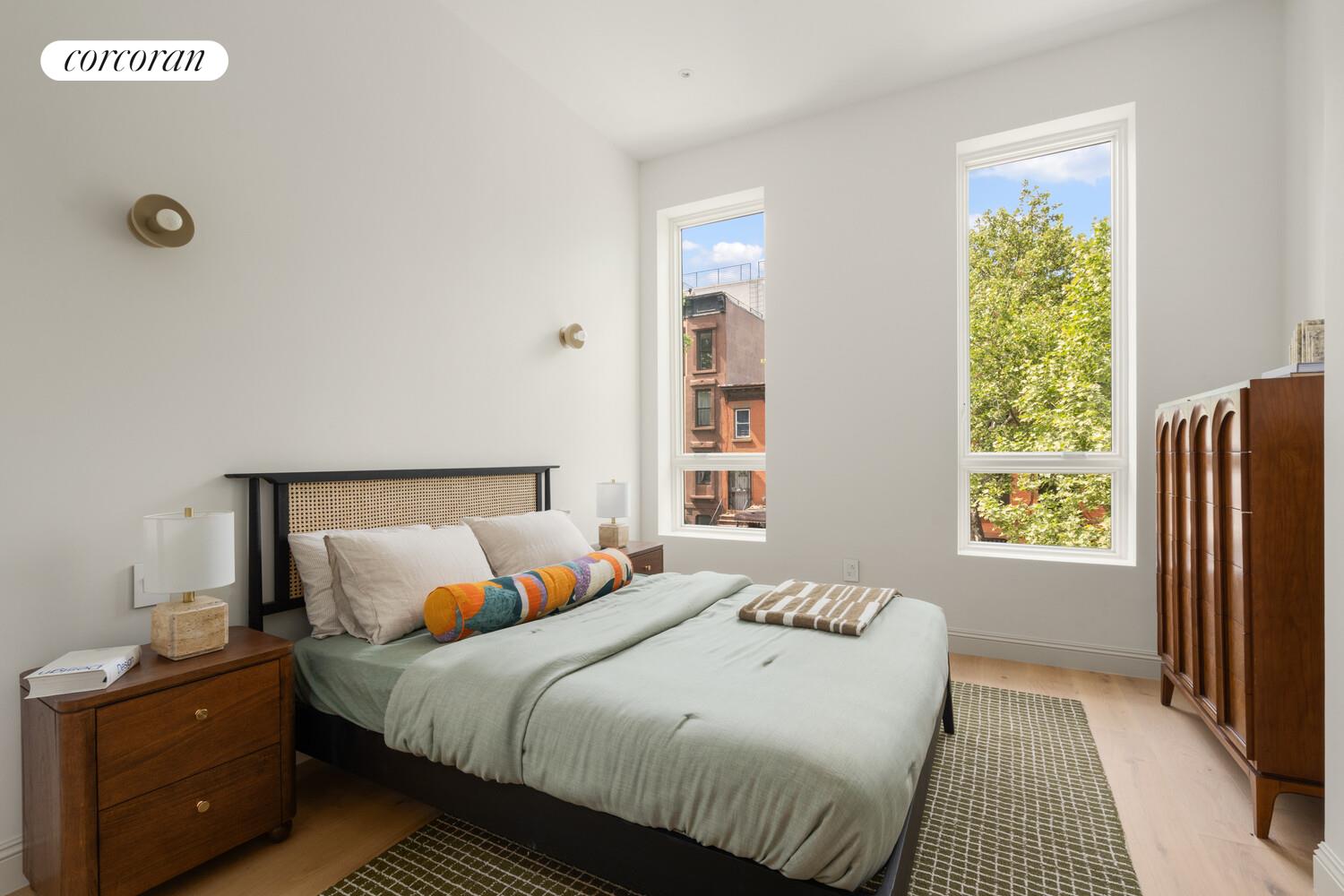700 Monroe Street Brooklyn, NY 11221 - Photo 12 of 18 a bedroom with a bed and a window