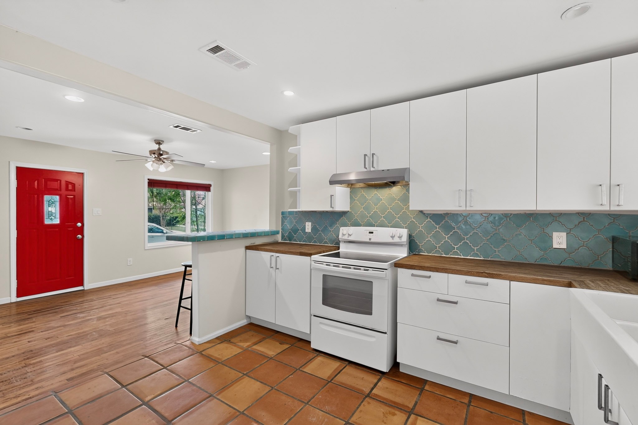 4711 Alf Avenue Austin, TX 78721 - Photo 10 of 34 Open-concept kitchen featuring a colorful tile backsplash