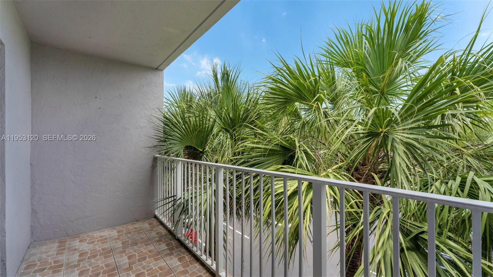 2780 West 76th Street, Unit 203 Hialeah, FL 33016 - Photo 21 of 21 a view of balcony with small plant
