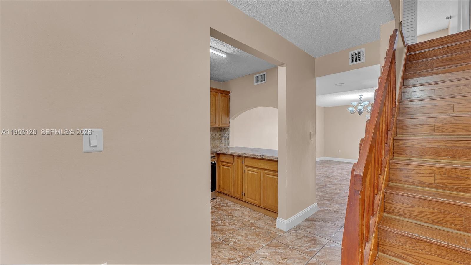 2780 West 76th Street, Unit 203 Hialeah, FL 33016 - Photo 4 of 21 a bathroom with a granite countertop sink and a mirror