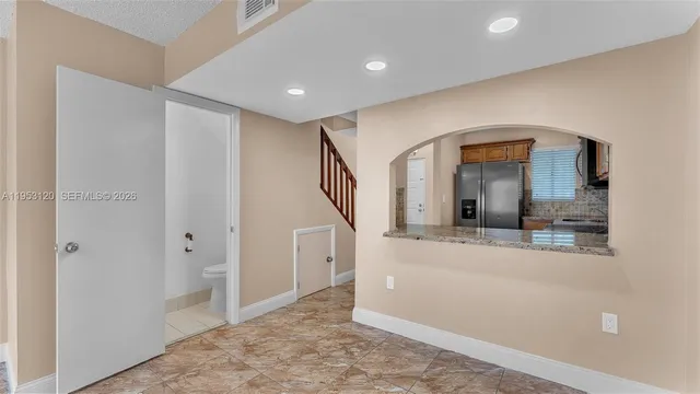 a view of a hallway view with staircase