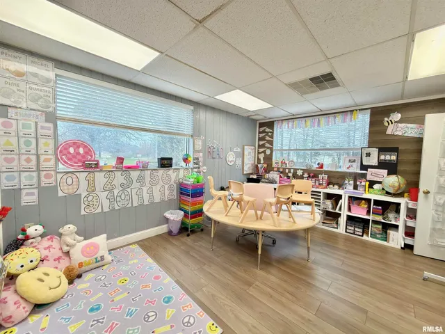 a bathroom with a double vanity sink toilet mirror and shower