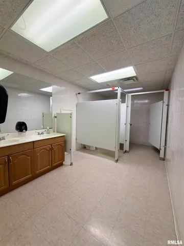 a living room with lots of furniture and a window