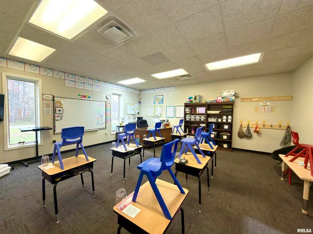 a workspace with furniture and window
