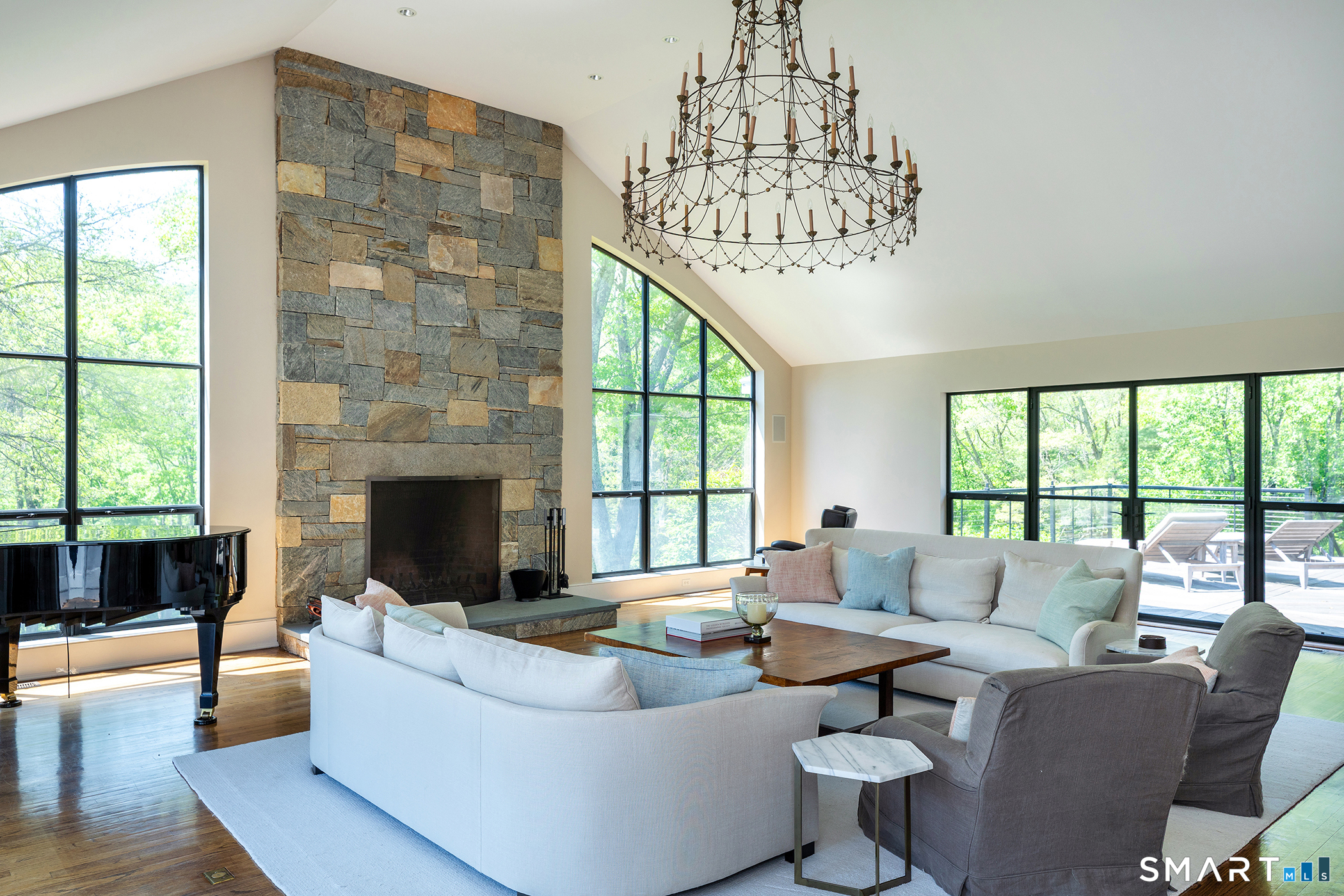47 Squire Road Roxbury, CT 06783 - Photo 6 of 27 a living room with fireplace furniture and a chandelier