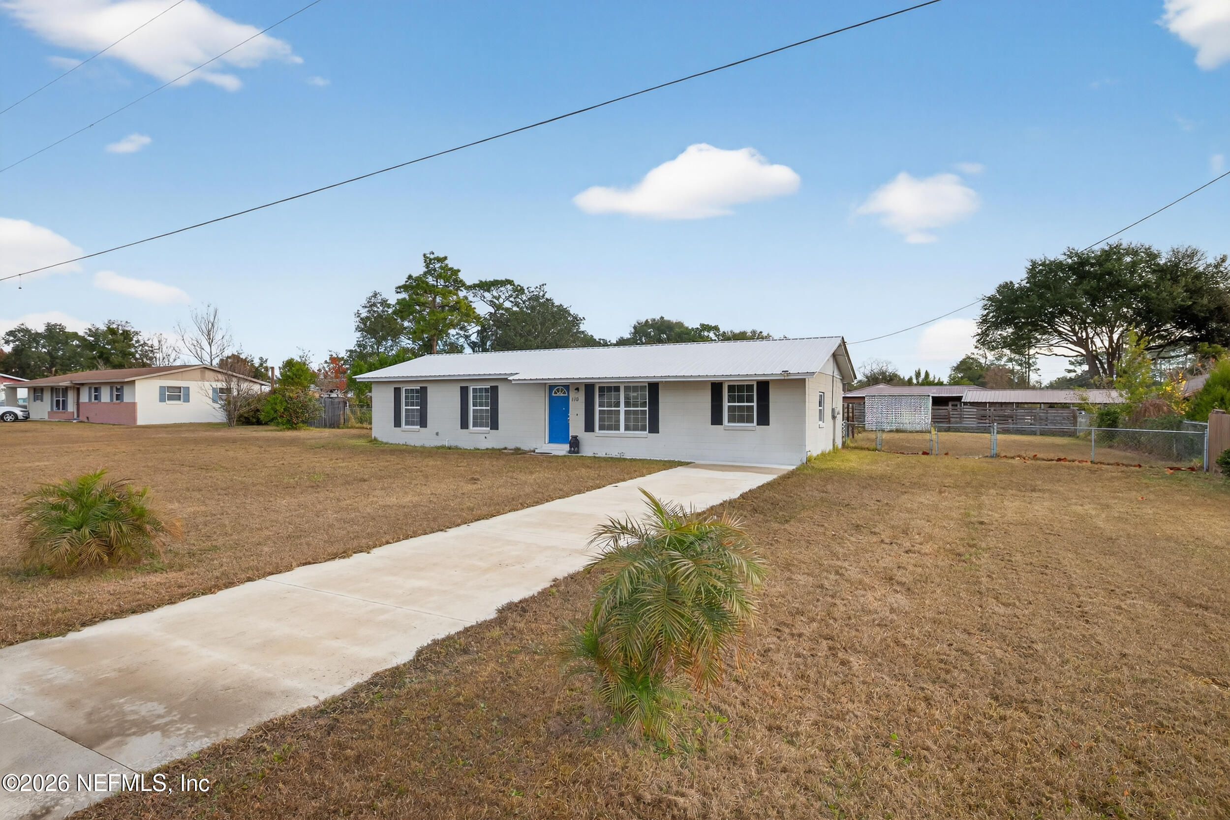 110 East Rellim Drive Palatka, FL 32177 - Photo 4 of 29 a front view of a house with a yard