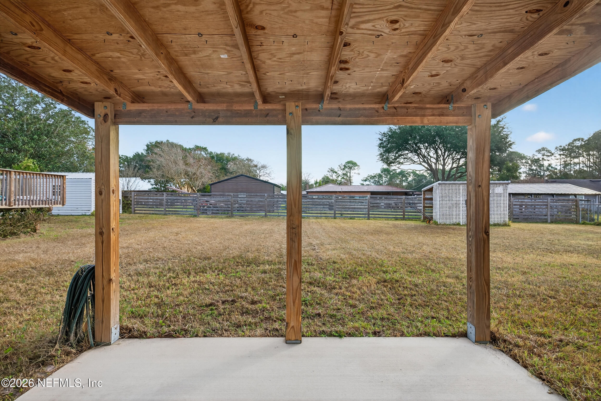 110 East Rellim Drive Palatka, FL 32177 - Photo 10 of 29 a view of a back yard from a balcony