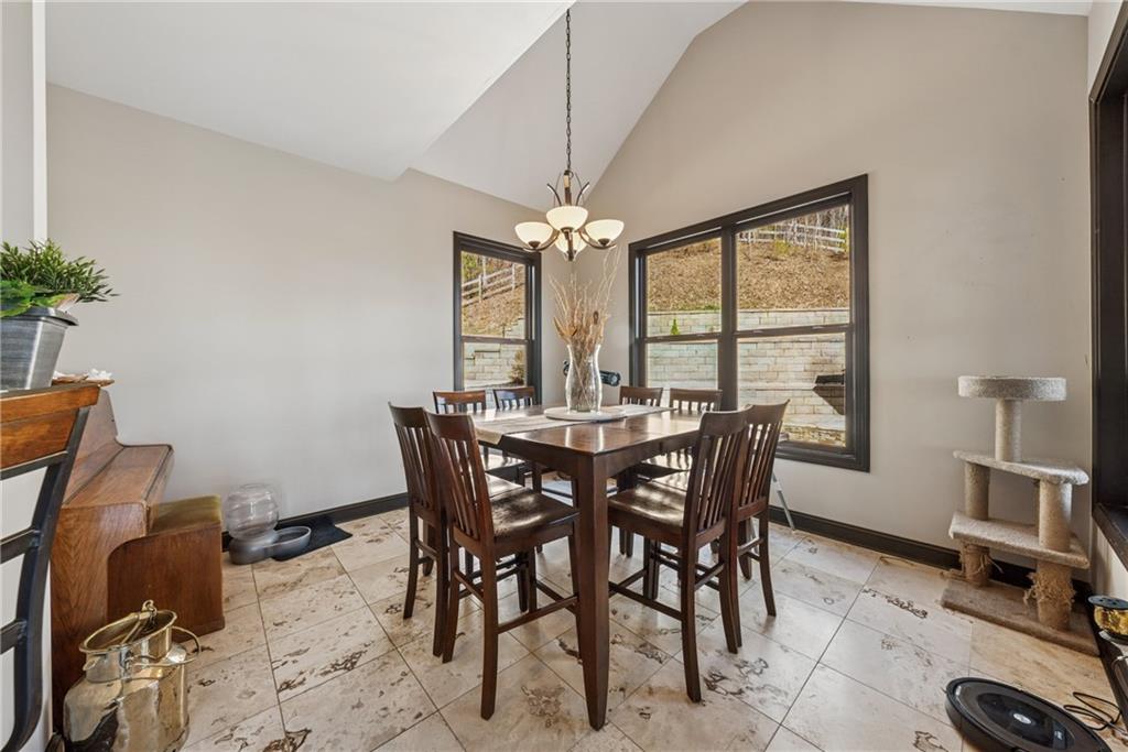 101 Bevil Ridge Road Southeast Emerson, GA 30137 - Photo 12 of 74 a dining room with furniture a chandelier and window
