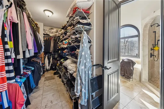 a bathroom with a bathtub a sink and a shower