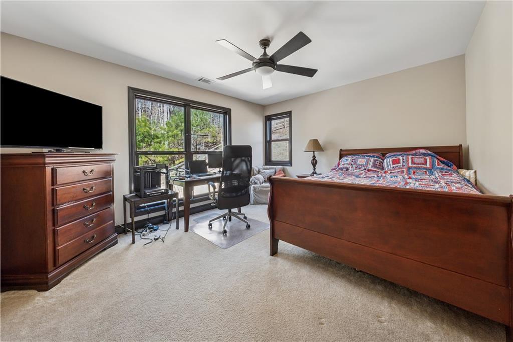 101 Bevil Ridge Road Southeast Emerson, GA 30137 - Photo 33 of 74 a living room with furniture and a flat screen tv
