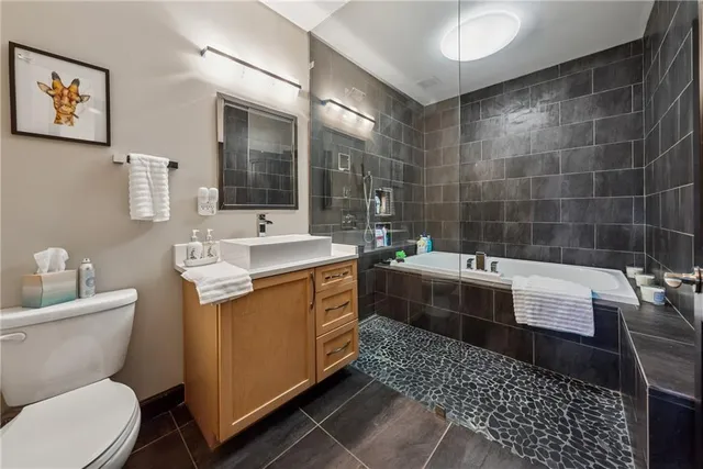 a balcony with furniture and wooden floor