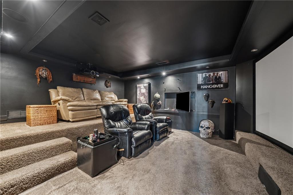 101 Bevil Ridge Road Southeast Emerson, GA 30137 - Photo 45 of 74 a garage with a couch and a flat screen tv