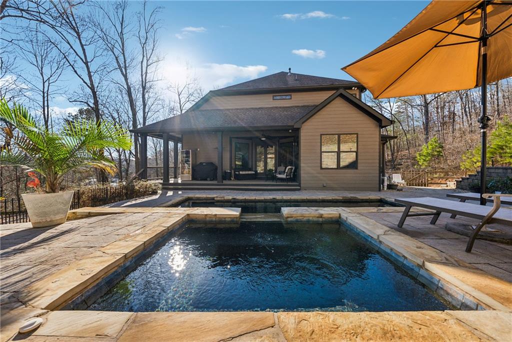 101 Bevil Ridge Road Southeast Emerson, GA 30137 - Photo 50 of 74 a view of a house with swimming pool and sitting area