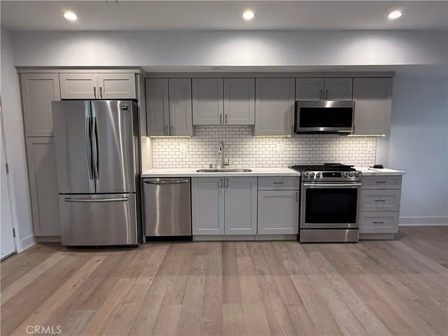 a bathroom with a toilet a sink and a bathtub