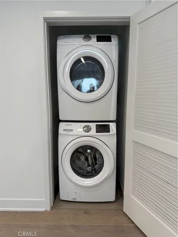 a kitchen with stainless steel appliances granite countertop a refrigerator a stove top oven a sink and dishwasher