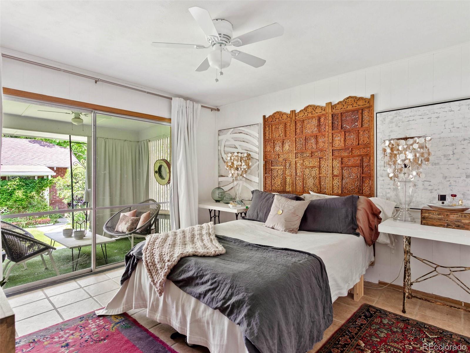 547 South Williams Street Denver, CO 80209 - Photo 12 of 18 a bedroom with a bed and glass window