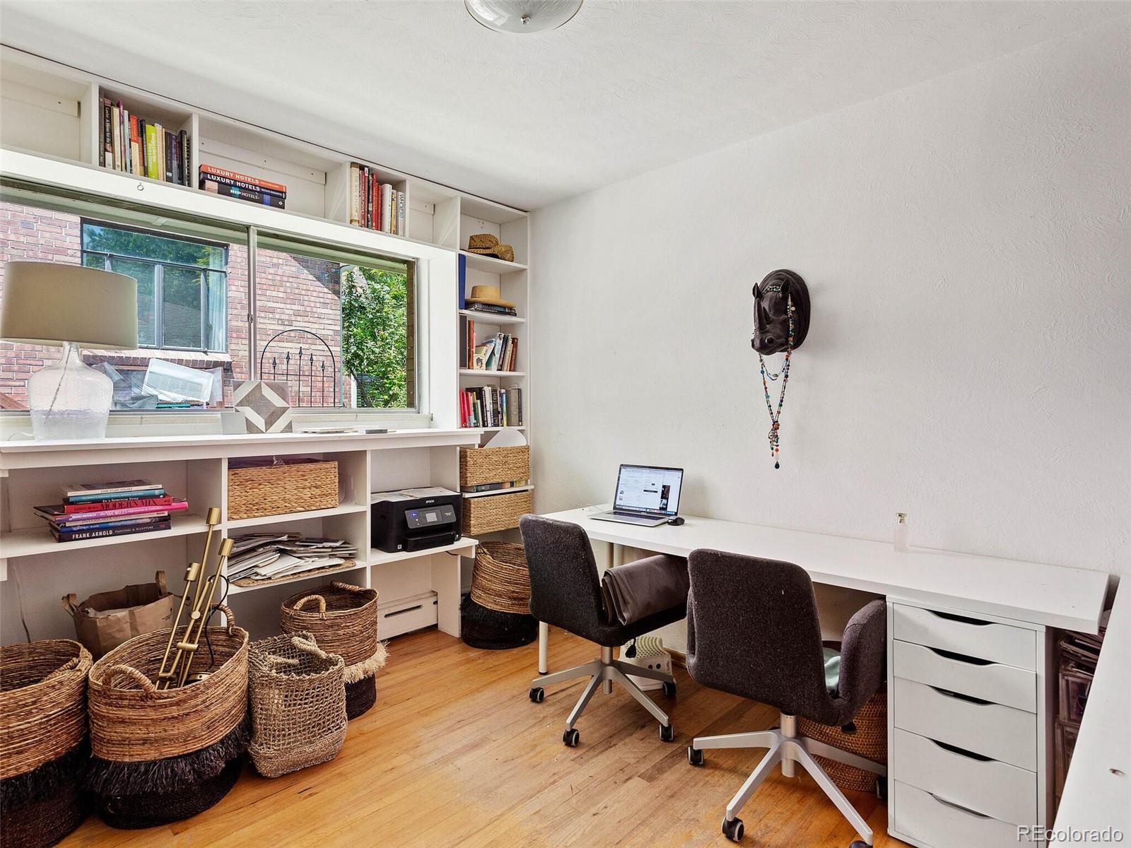 547 South Williams Street Denver, CO 80209 - Photo 13 of 18 a view of a workspace with furniture and a window