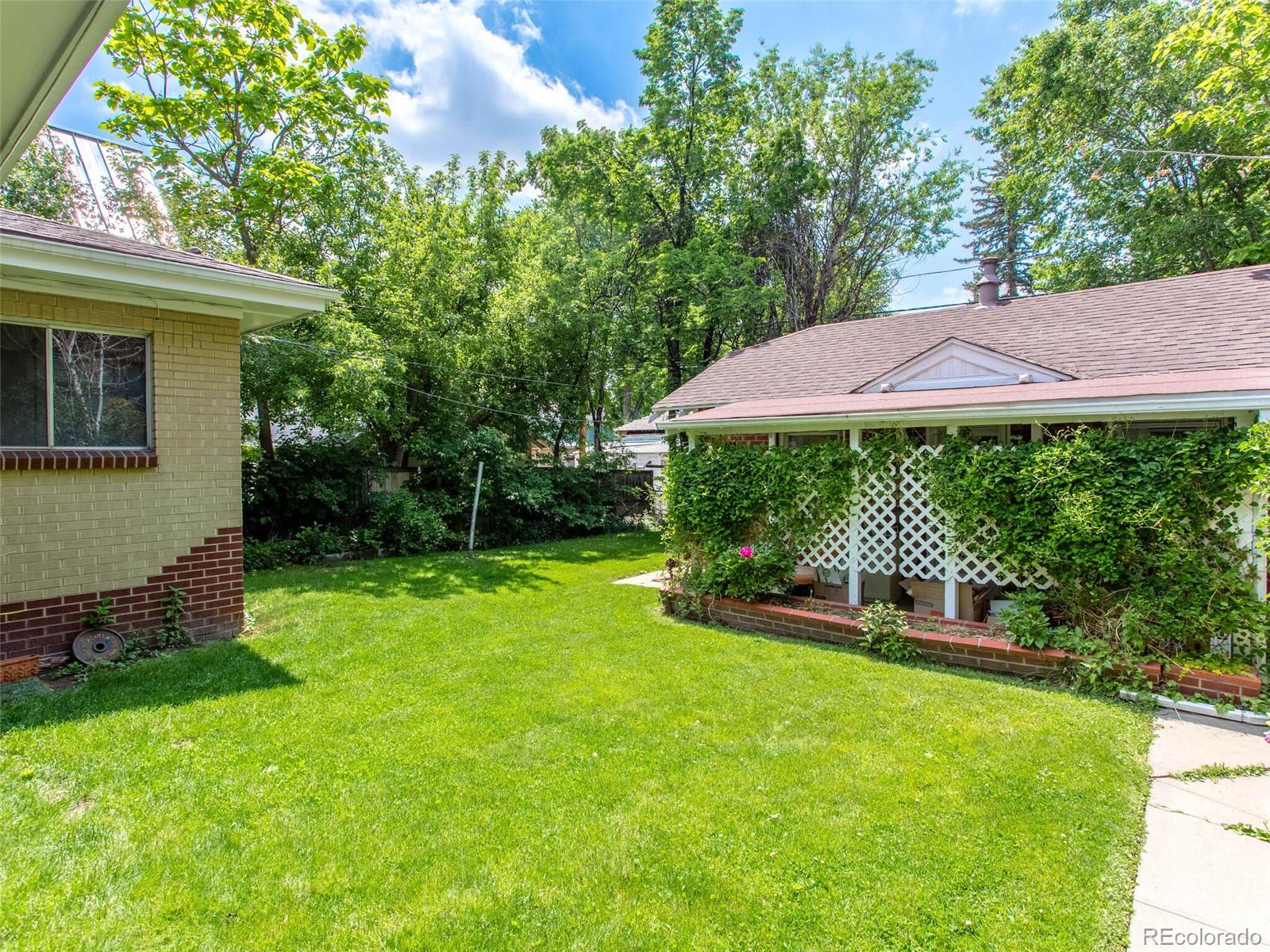 547 South Williams Street Denver, CO 80209 - Photo 3 of 18 a view of a house with a yard and sitting area