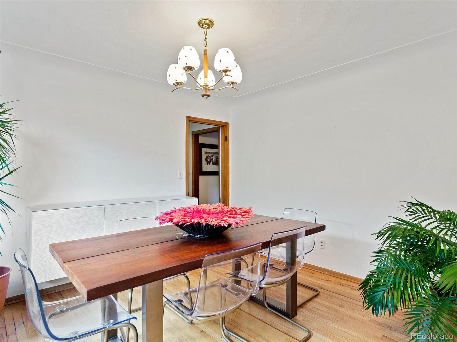 547 South Williams Street Denver, CO 80209 - Photo 9 of 18 a view of a dining room with furniture and chandelier