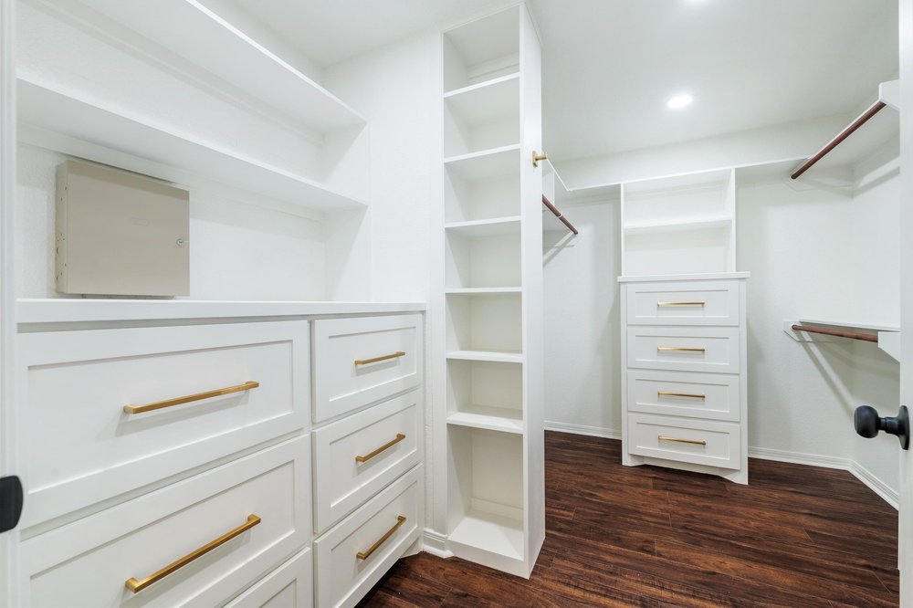 209 El Rio Drive Lakeway, TX 78734 - Photo 25 of 40 a view of walk in closet with empty racks