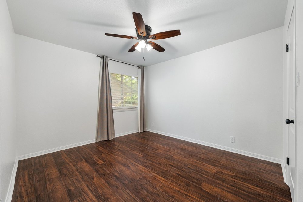 209 El Rio Drive Lakeway, TX 78734 - Photo 27 of 40 a view of empty room with wooden floor