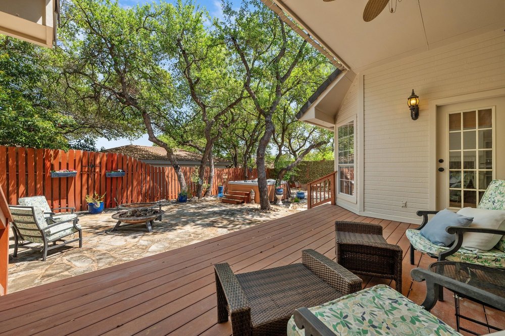209 El Rio Drive Lakeway, TX 78734 - Photo 33 of 40 a view of a backyard with a patio
