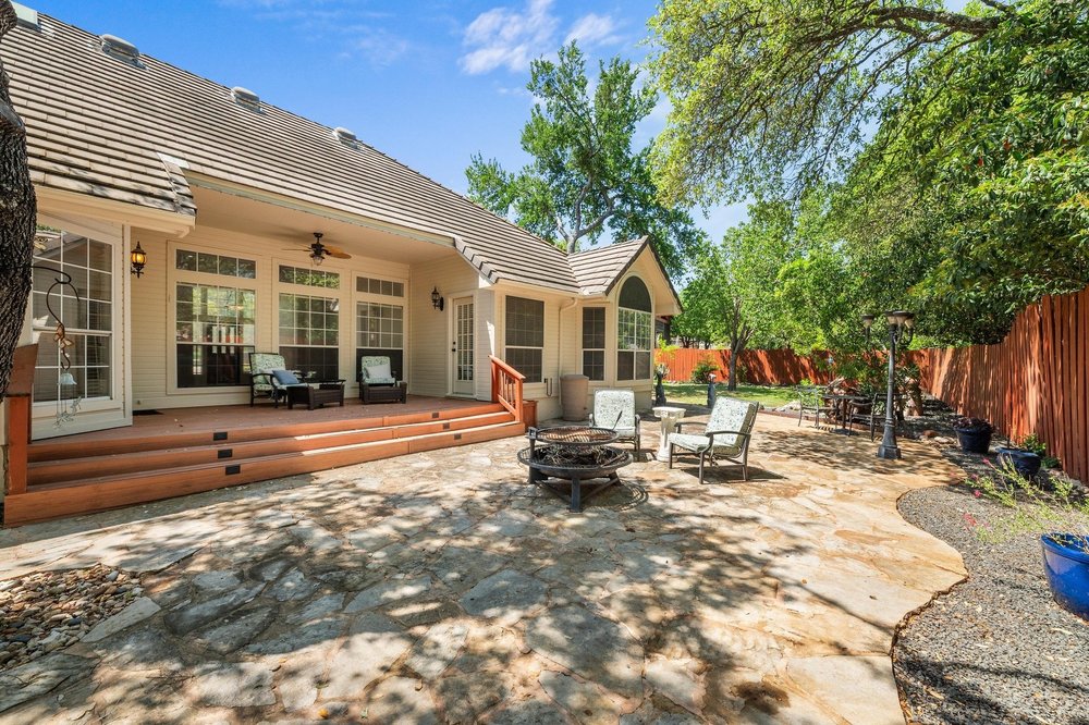 209 El Rio Drive Lakeway, TX 78734 - Photo 34 of 40 a view of a house with backyard porch and sitting area