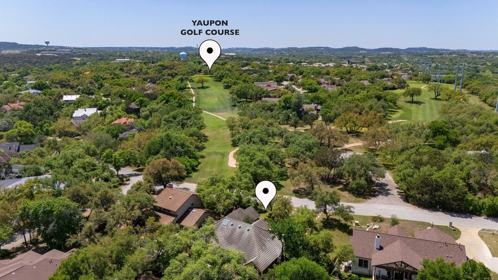 209 El Rio Drive Lakeway, TX 78734 - Photo 38 of 40 an aerial view of a house with a yard