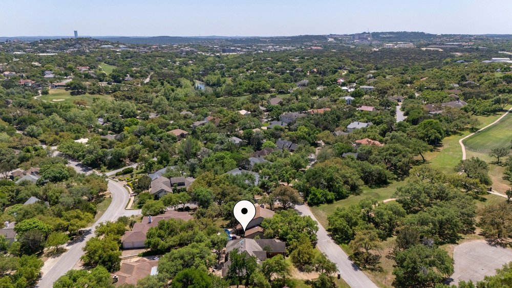 209 El Rio Drive Lakeway, TX 78734 - Photo 40 of 40 an aerial view of a city with lots of residential buildings