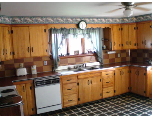 108 S Road Templeton, MA 01468 - Photo 6 of 18 a kitchen with stainless steel appliances a counter space and a window